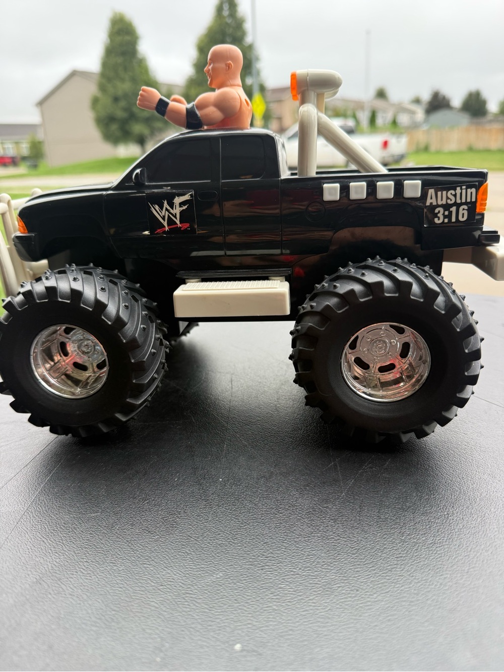 Vintage WWF Austin 3:16 Black Monster Truck Toy with Action Figure